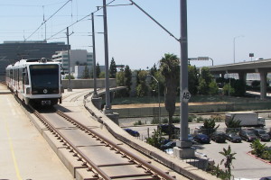 This is a recent view of the Green Line Station at Aviation Blvd. This shows construction from the 1990's that will be used to extend Light Rail to LAX. Also you can the tracks of the Santa Fe Harbor Line.