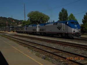 Train #6, the California Zephyr, is loading at the four-track Martinez station.  The foreground shows a bit of the former passenger platform that was replaced by the modern platforms in the distance.